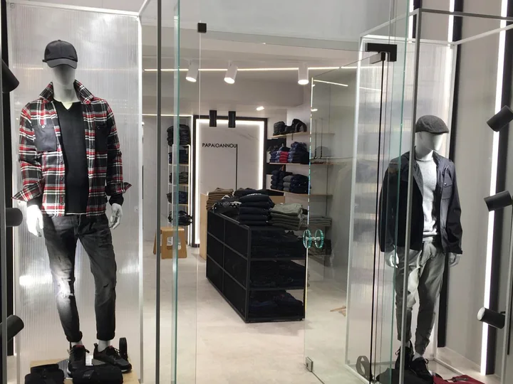A menswear window display at the shop.